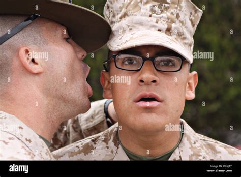 A Us Marine Corps Drill Instructor Screams At A Marine Recruit During A Us Marine Corps Drill Instructor Screams At A Marine Recruit During